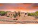 Charming desert home featuring adobe construction, desert landscaping, and a brick pathway at 29619 N 142Nd Pl, Scottsdale, AZ 85262