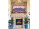 Close-up of stone fireplace featuring a mantle, hearth, and display of a mountain view at 29619 N 142Nd Pl, Scottsdale, AZ 85262