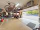 Garage with overhead storage, bikes, and motorcycles at 29619 N 142Nd Pl, Scottsdale, AZ 85262