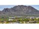 Picturesque view of the neighborhood homes nestled among a landscape of mountains and desert foliage at 29619 N 142Nd Pl, Scottsdale, AZ 85262