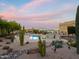 Stunning pool with lush desert landscaping, offering a serene and private outdoor oasis for relaxation and enjoyment at 29619 N 142Nd Pl, Scottsdale, AZ 85262