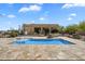 Backyard pool with desert views and stone patio, great for outdoor entertaining and relaxation at 29619 N 142Nd Pl, Scottsdale, AZ 85262