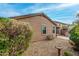 Back of house overlooking backyard featuring gravel landscaping and patio at 3038 W Trapanotto Rd, Phoenix, AZ 85086