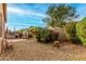 Backyard features gravel landscaping, an outdoor kitchen and fireplace at 3038 W Trapanotto Rd, Phoenix, AZ 85086