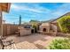 Outdoor kitchen area and fireplace feature in backyard space at 3038 W Trapanotto Rd, Phoenix, AZ 85086
