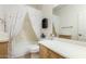 Bright bathroom with a large mirror, wood cabinet, shower/tub combination at 3038 W Trapanotto Rd, Phoenix, AZ 85086