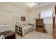 Cozy bedroom featuring wood-look floors and a comfortable day bed at 3038 W Trapanotto Rd, Phoenix, AZ 85086