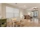 Cozy dining area with a bright window and a view into the adjacent living room at 3038 W Trapanotto Rd, Phoenix, AZ 85086