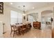 Inviting dining area featuring wood floors and access to the kitchen at 3038 W Trapanotto Rd, Phoenix, AZ 85086