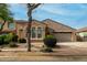 Charming single-story home featuring desert landscaping, a two-car garage, and a welcoming front entrance at 3038 W Trapanotto Rd, Phoenix, AZ 85086