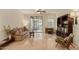 Inviting living room featuring hardwood floors, a ceiling fan, and access to a screened-in patio at 3038 W Trapanotto Rd, Phoenix, AZ 85086