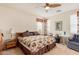 Spacious main bedroom featuring light walls and carpet with a wooden bed frame at 3038 W Trapanotto Rd, Phoenix, AZ 85086