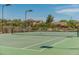 Well-maintained community tennis court with green surface, new netting, and scenic views of surrounding homes and landscapes at 3038 W Trapanotto Rd, Phoenix, AZ 85086