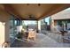 Covered patio featuring a tile floor, ceiling fan, and outdoor dining at 30600 N Pima Rd # 81, Scottsdale, AZ 85266