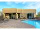 Private backyard with a pool and patio area surrounded by desert landscaping at 30600 N Pima Rd # 81, Scottsdale, AZ 85266