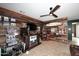 Custom bar area featuring a wood wall, fun memorabilia, and gaming area at 30600 N Pima Rd # 81, Scottsdale, AZ 85266
