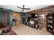 Entertaining bar area featuring wood wall, ceiling fan, and kitchenette at 30600 N Pima Rd # 81, Scottsdale, AZ 85266