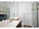 Bright bathroom with a glass enclosed shower and dark wood cabinets at 30600 N Pima Rd # 81, Scottsdale, AZ 85266
