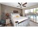 Charming bedroom with a rustic bed and direct access to the backyard pool area at 30600 N Pima Rd # 81, Scottsdale, AZ 85266