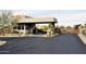 Community entrance featuring a gate, guard booth, and desert landscaping at 30600 N Pima Rd # 81, Scottsdale, AZ 85266