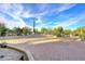 Paver driveway leads up to the property and desert landscaping at 30600 N Pima Rd # 81, Scottsdale, AZ 85266