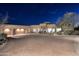 Stunning home with a circular driveway, desert landscaping, and an attached three-car garage at 30600 N Pima Rd # 81, Scottsdale, AZ 85266