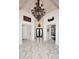 Foyer with marble floors and ornate chandelier at 30600 N Pima Rd # 81, Scottsdale, AZ 85266