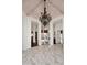 Spacious foyer with marble floors and a beautiful chandelier at 30600 N Pima Rd # 81, Scottsdale, AZ 85266