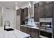 Contemporary kitchen with a stainless steel refrigerator, sleek countertops, and custom cabinets at 30600 N Pima Rd # 81, Scottsdale, AZ 85266