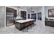 Bright kitchen features a large island, modern stainless steel appliances, and tile flooring at 30600 N Pima Rd # 81, Scottsdale, AZ 85266