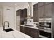 Stylish kitchen features a large island, stainless steel appliances, and sleek, modern finishes at 30600 N Pima Rd # 81, Scottsdale, AZ 85266