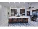 Stylish kitchen with a large island, bar seating, and sleek stainless steel appliances at 30600 N Pima Rd # 81, Scottsdale, AZ 85266