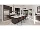 Gourmet kitchen features an island with countertop seating and stainless steel appliances at 30600 N Pima Rd # 81, Scottsdale, AZ 85266