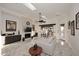 Bright living room with white marble floors and contemporary fireplace at 30600 N Pima Rd # 81, Scottsdale, AZ 85266