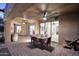 Covered outdoor patio with dining set, wine barrel, and comfortable seating area perfect for entertaining at 30600 N Pima Rd # 81, Scottsdale, AZ 85266