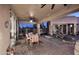Outdoor patio with dining table, multiple ceiling fans, water feature, and view of the backyard at 30600 N Pima Rd # 81, Scottsdale, AZ 85266