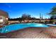 Pool area with desert landscaping and outdoor seating, perfect for evening relaxation and entertaining at 30600 N Pima Rd # 81, Scottsdale, AZ 85266