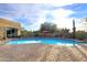 Backyard pool featuring desert landscaping, brick pavers, and outdoor seating at 30600 N Pima Rd # 81, Scottsdale, AZ 85266