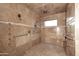 Tiled shower with multiple showerheads and a built-in bench for a luxurious bathing experience at 30600 N Pima Rd # 81, Scottsdale, AZ 85266