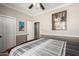 Bedroom featuring crown moulding, two-tone paint, and carpet with a queen bed at 3241 E Hampton Ln, Gilbert, AZ 85295