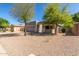 Charming single-story home featuring a two-car garage, neutral stucco exterior, and easy to maintain desert landscaping at 3241 E Hampton Ln, Gilbert, AZ 85295