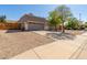 Lovely single-story home featuring a two-car garage, neutral stucco exterior, and drought-tolerant desert landscaping at 3241 E Hampton Ln, Gilbert, AZ 85295