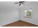 Bright bedroom featuring laminate flooring, a ceiling fan, and a window that brings in plenty of natural light at 3284 E Sandy Way, Gilbert, AZ 85297