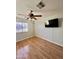 Bedroom with hardwood floors, natural light, and ceiling fan at 3284 E Sandy Way, Gilbert, AZ 85297