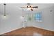 Bedroom featuring laminate flooring, a ceiling fan, and two windows that bring in plenty of natural light at 3284 E Sandy Way, Gilbert, AZ 85297
