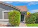 Charming front exterior with lush landscaping and covered front entryway at 3284 E Sandy Way, Gilbert, AZ 85297