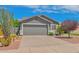 Charming single story home with well-manicured xeriscaped front yard and a large two-car garage at 3284 E Sandy Way, Gilbert, AZ 85297