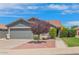 Charming single story home with well-manicured front yard and a large two-car garage at 3284 E Sandy Way, Gilbert, AZ 85297