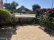 Charming front yard area with patio, garden beds, and colorful bougainvillea hedge at 3284 E Sandy Way, Gilbert, AZ 85297