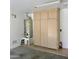The garage is equipped with a water heater, cabinets, and tiled floors at 3284 E Sandy Way, Gilbert, AZ 85297